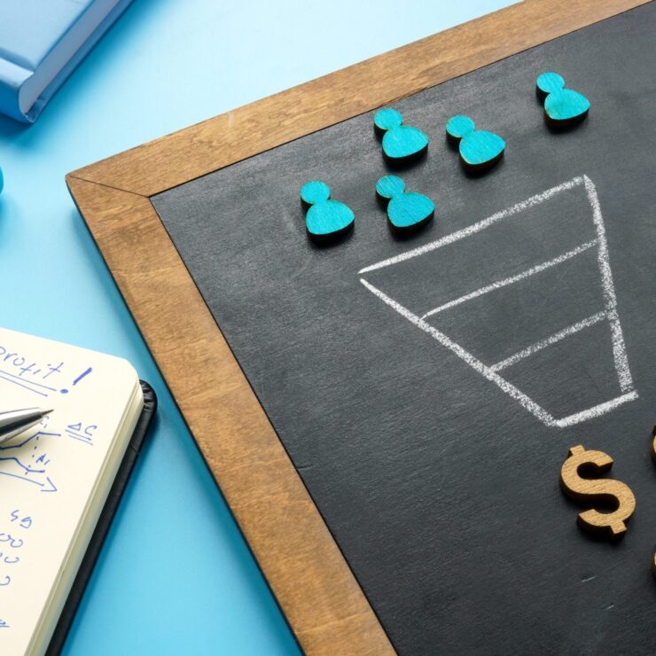 Marketing,Sales,Funnel,On,The,Blackboard,And,Figurines.